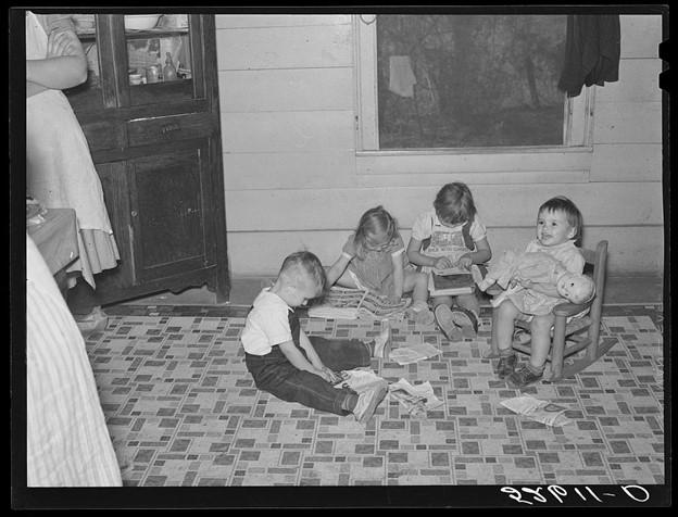 Children playing and cutting out pictures from Sears Roebuck catalog, 1939, Library of Congress