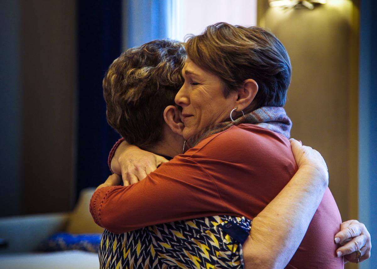 Laurie Ogilvie, left, is reunited with her daughter Denise Marie Mills at Ogilvie's her home in Vancouver, WA. Mills was given up for adoption when she was born. The two were recently reunited after a search on ancestry.com brought them together. (Michael Kroh, Contributing Photographer)