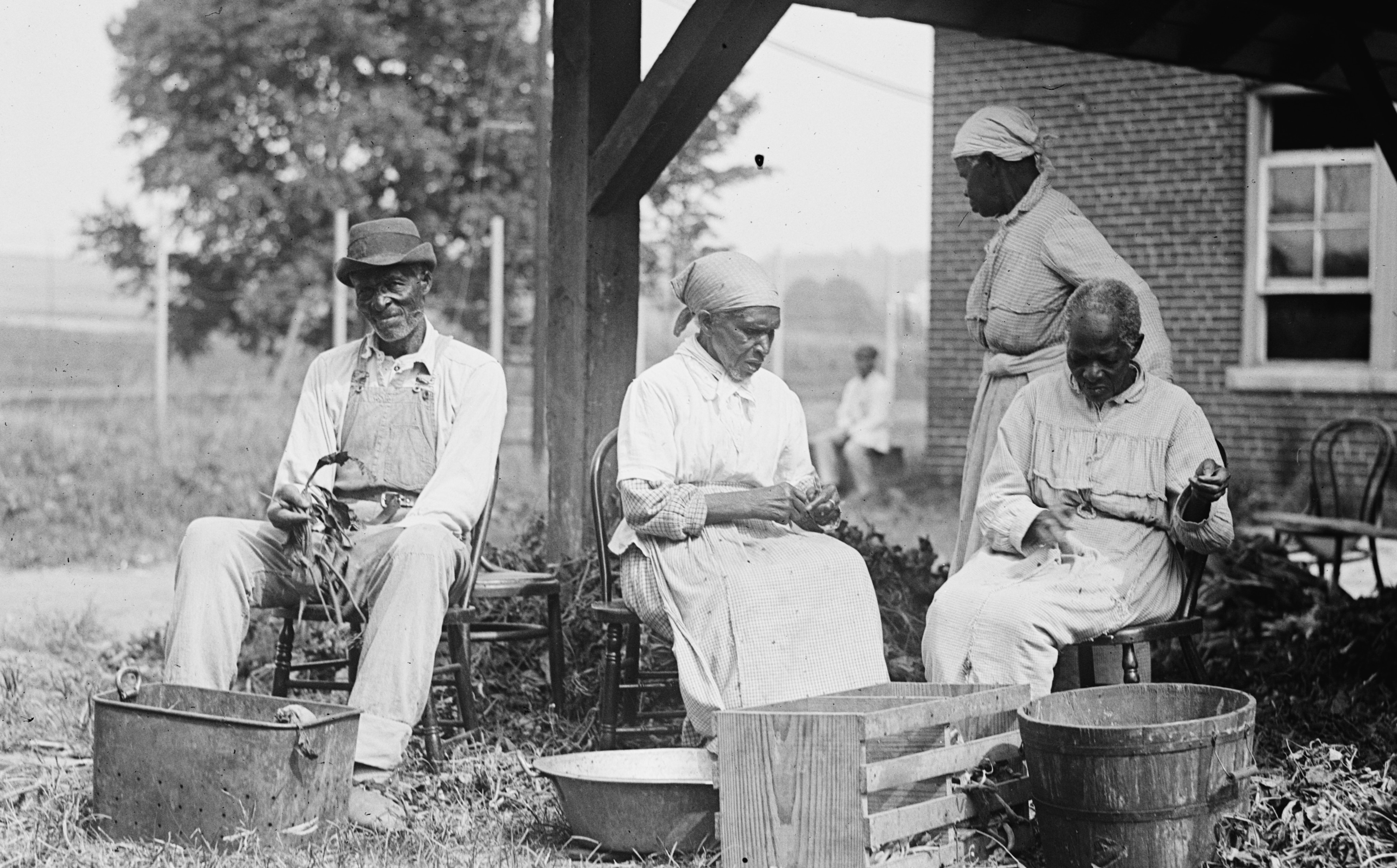 African-American family working on plantation.