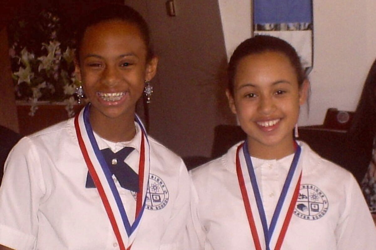Lisa and Franceen with medals around their necks.