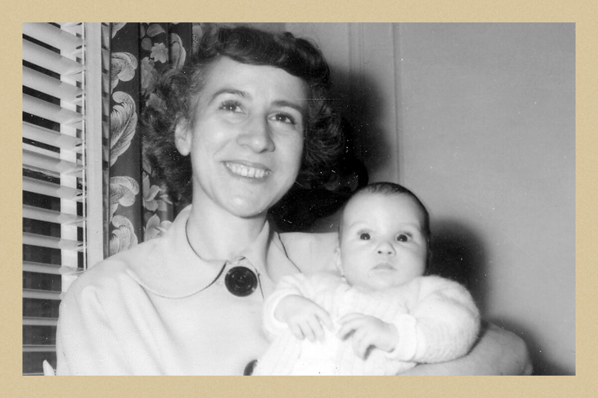 Joyce being held by her mother.