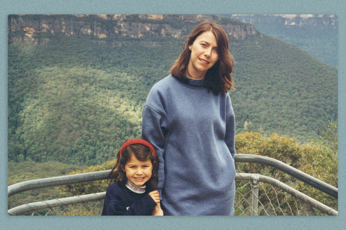 The author as a child standing at a lookout point with her mother.