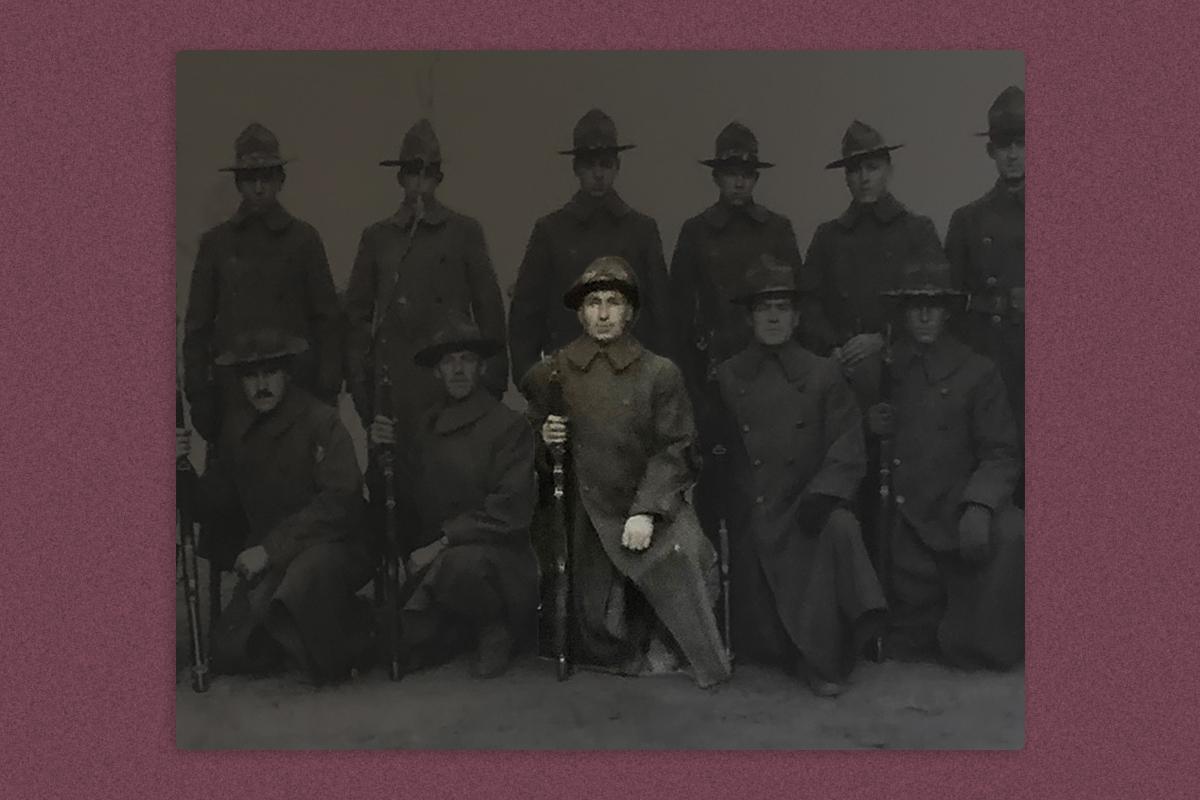 Group photo of U.S. soldiers during WWI, with Michael Valente highlighted in the forefront