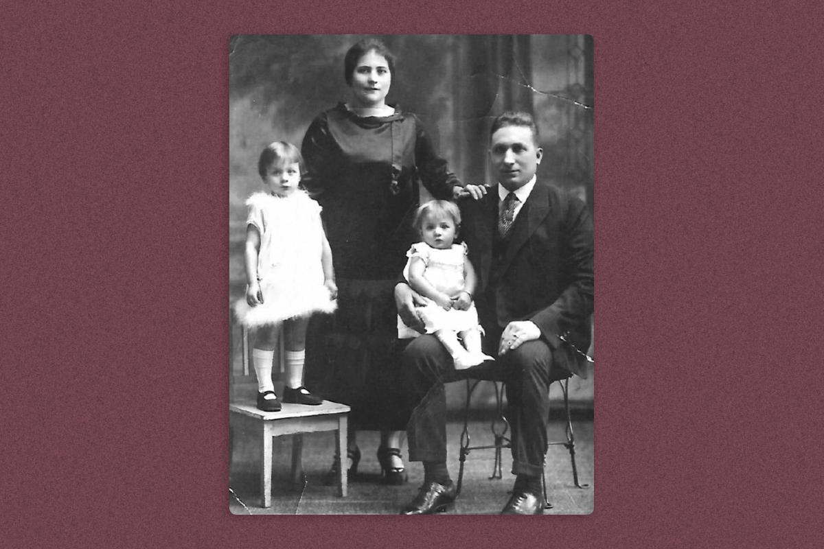 A family portrait of Michael Valente, his wife, and two young daughters
