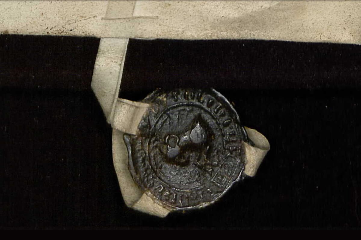 Closeup of wax seal on a centuries-old document.