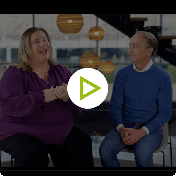 Video still frame of Crista Cowan talking to Ancestry CEO Howard Hochhauser.